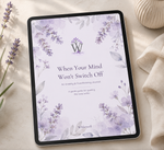 A tablet displaying a lavender watercolor journal cover with the title 'When Your Mind Won't Switch Off' and the brand name 'Wilderwell', styled on a light beige surface with lavender sprigs and a cream textured bowl.