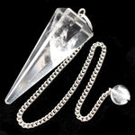 Crystal pendulum with chain on a black background